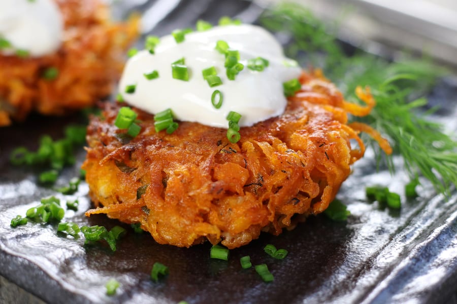 Sweet Potato Hash Browns on a wavy grey plate.