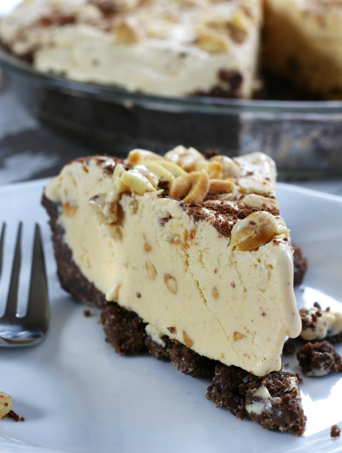 A slice of Mom's Frozen Peanut Butter Pie on a white plate.