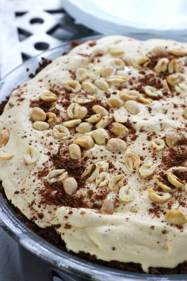 Peanut Butter Ice Cream Pie topped with peanuts and chocolate cookie crumbles.