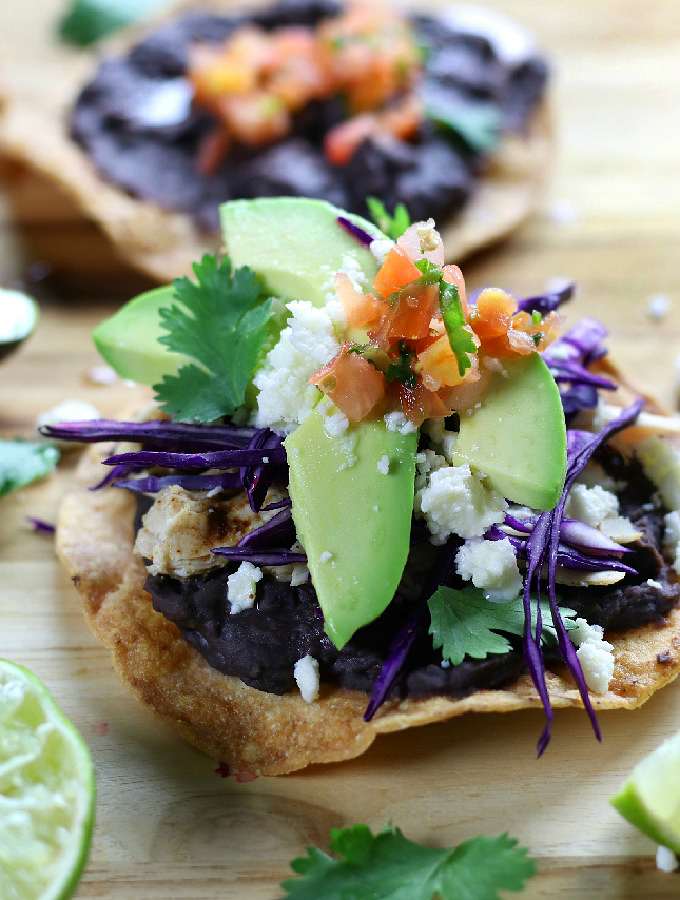 Healthy Baked Tostadas on a wooden board.