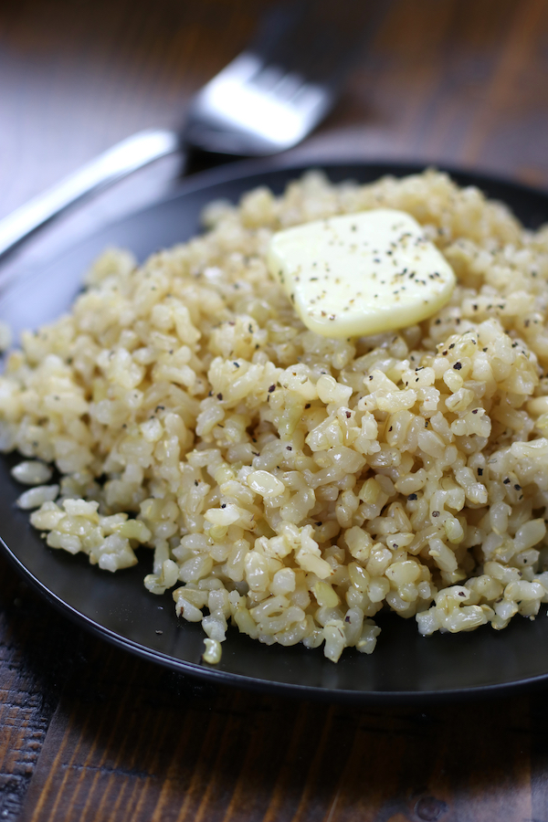 Healthy Rice Recipe that is cooked on a black plate.