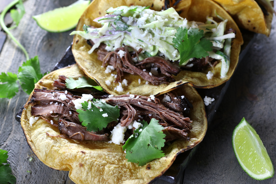 Formed tacos from Beef Taco Recipe with large shreds of beef.