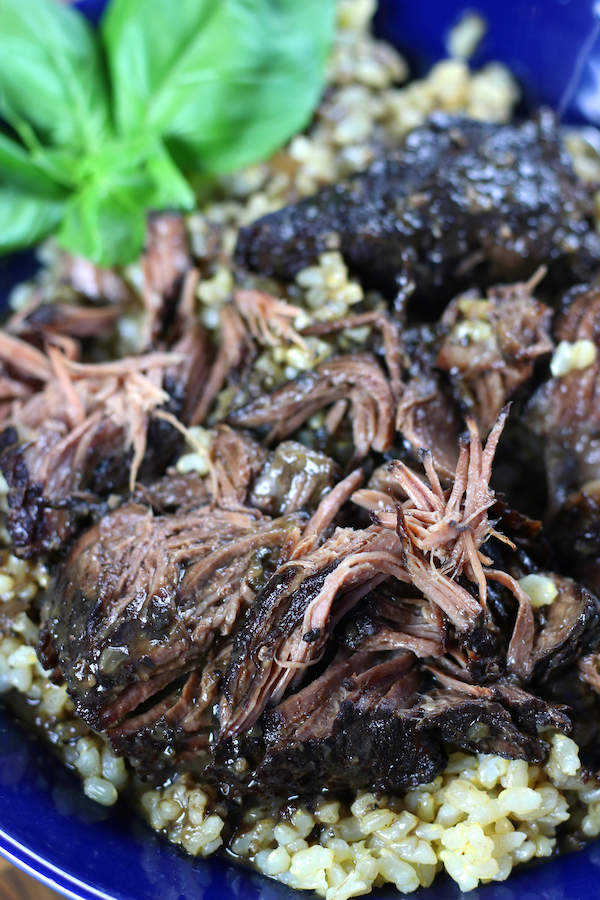 A serving of Peposo Recipe in a blue bowl.