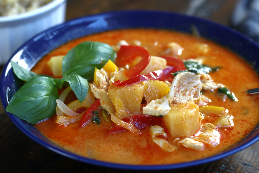 Up close photo of a bowl of Thai Pineapple Chicken Recipe.