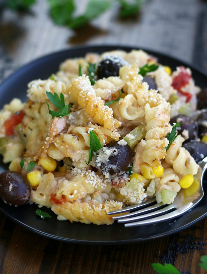 Salmon Noodle Casserole on a black plate.
