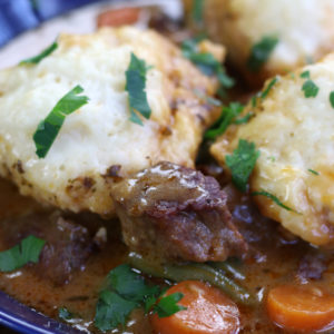 Up close photo of a serving of Beef Stew and Dumplings.