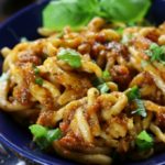 Pici All'Aglione Recipe (Tuscan Pasta with Tomato-Garlic Sauce in a blue serving bowl.