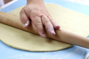 Rolling Out of Pici Dough with a rolling pin.