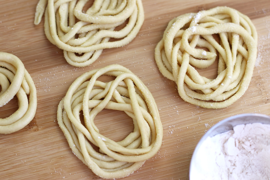 Homemade Tuscan Pici laid out in bundles.