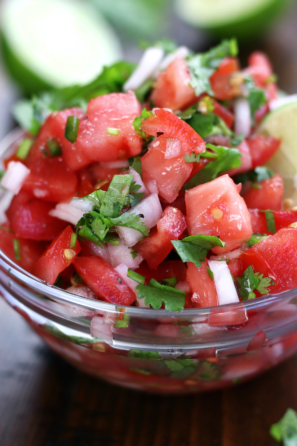 Up close photo of Chunky Salsa with white onion and cilantro.