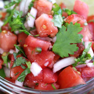 Pico de Gallo in a clear glass bowl.