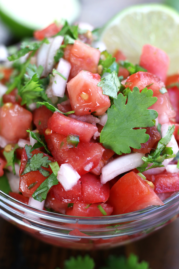 Pico de Gallo in a clear glass bowl.