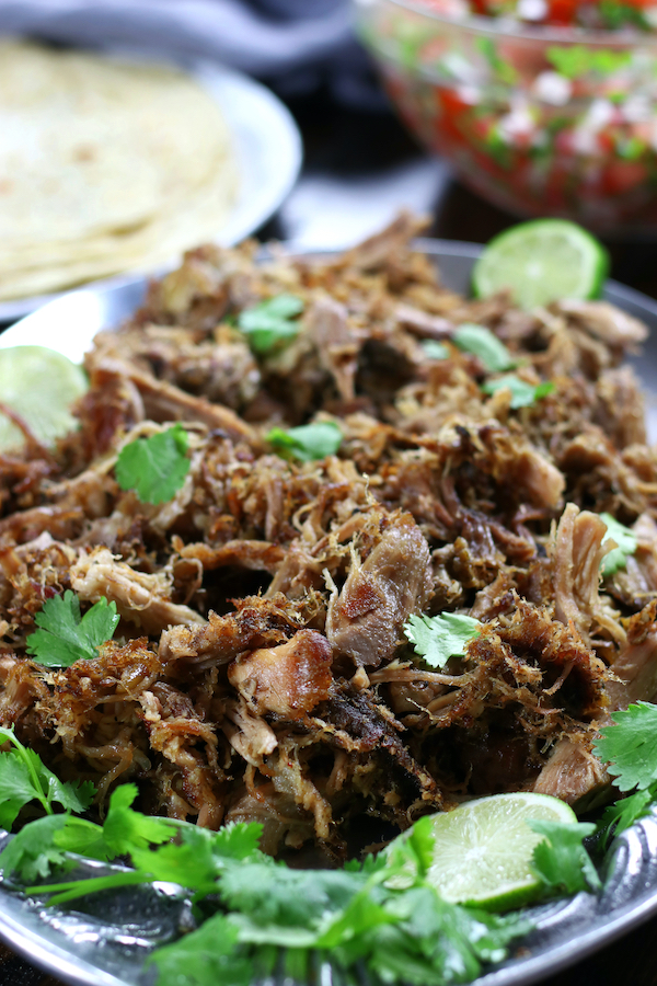 Shredded Slow Cooker Carnitas on silver platter.