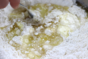 Adding Oil and Water to Dry Ingredients for Homemade Tortillas