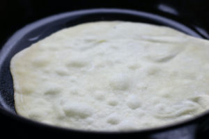 Cooking the First Side of a Homemade Flour Tortilla
