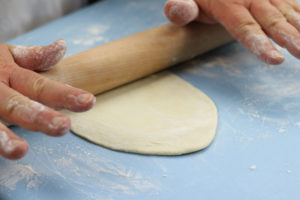Using a Rolling Pin To Roll Out Flour Tortillas