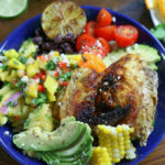 Overhead photo of Baja Chicken Bowl sitting on a brown table.