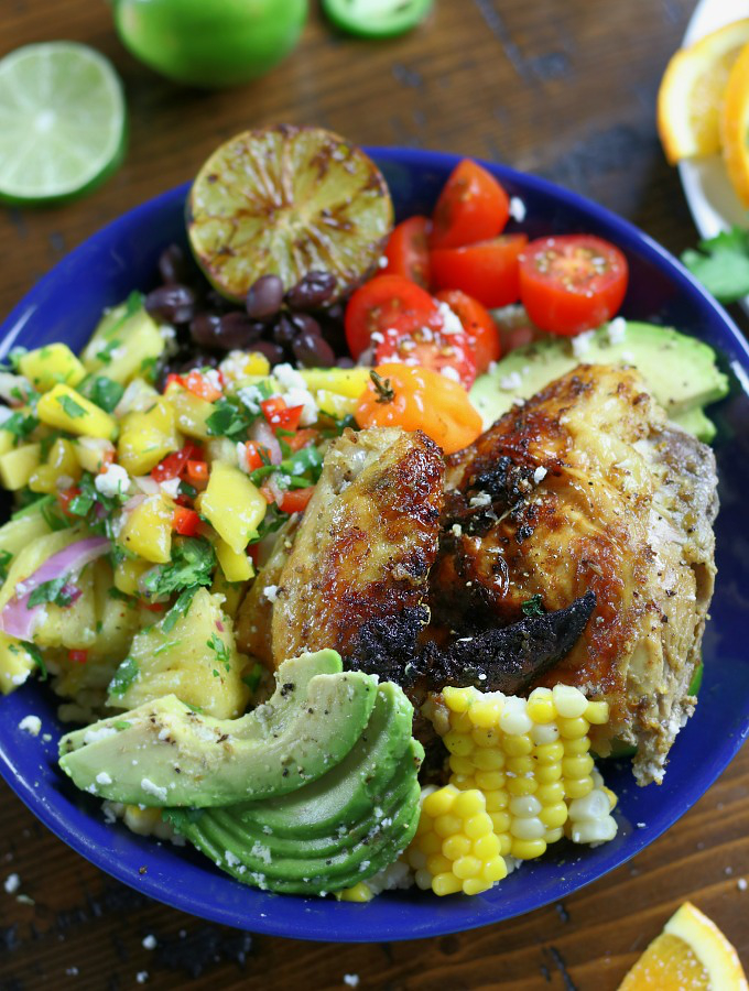 Overhead photo of Baja Chicken Bowl sitting on a brown table.