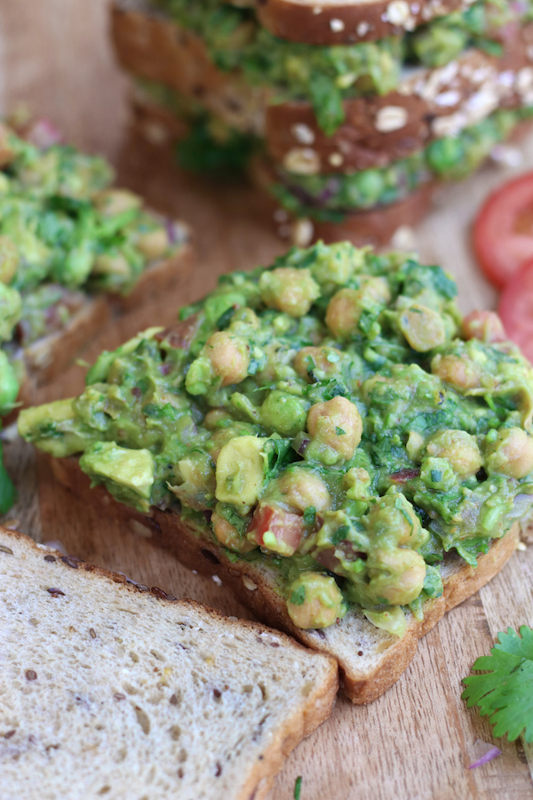 An open Chickpea Salad Sandwich with two slices of whole grain bread.