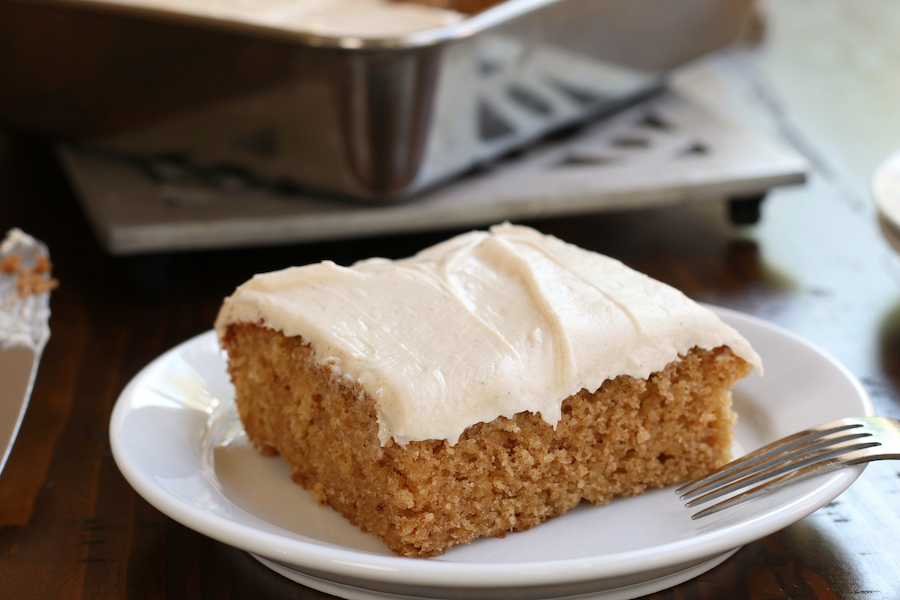 Fluffy Applesauce Cake Recipe topped with cinnamon cream cheese.