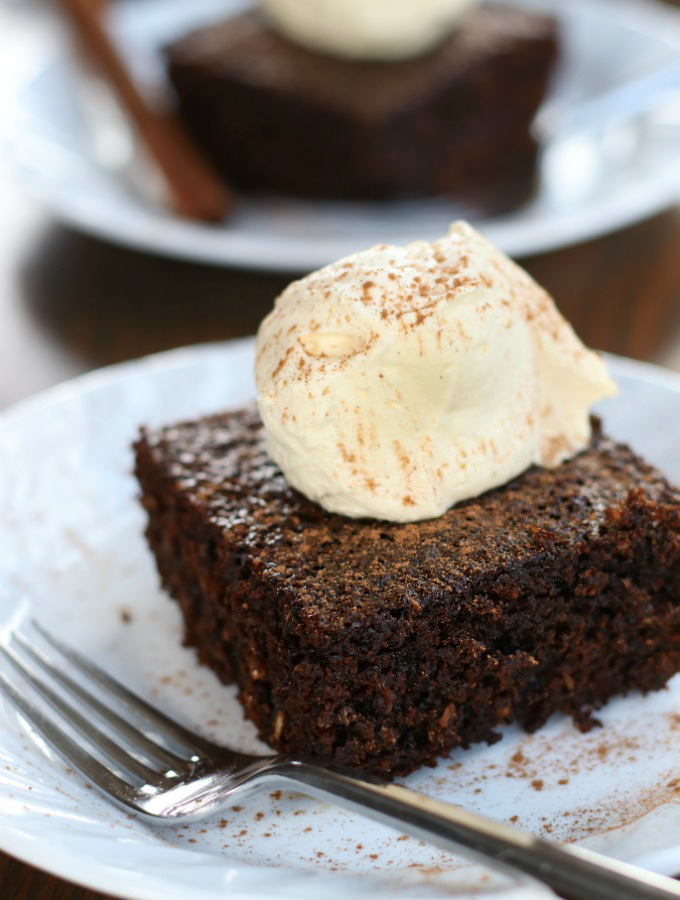 A slice of Broonie sitting on a white plate with a fork.