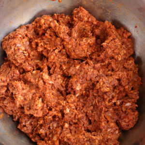 Mexican Chorizo Sausage in the raw form sitting in a stainless steel bowl.