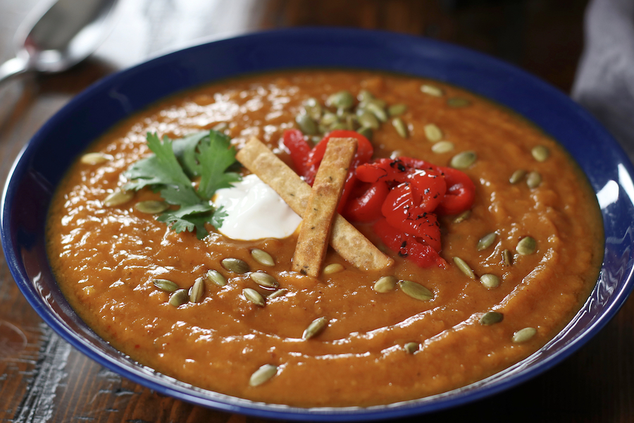 Healthy Sweet Potato Soup served with different garnishes.