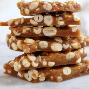 Mom's Old Fashioned Peanut Brittle stacked in a pile.