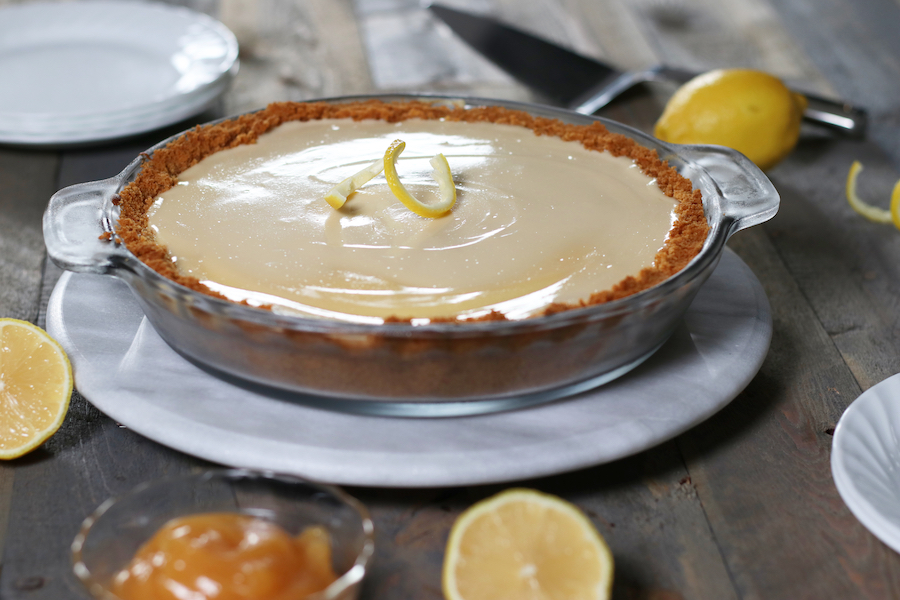 Ice Box Pie in a glass pie pan sitting on a lazy Susan.