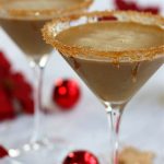 Two Gingerbread Martinis sitting on a white table.