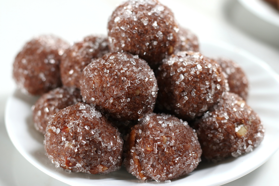 No Bake Rum Balls sitting on a white plate.