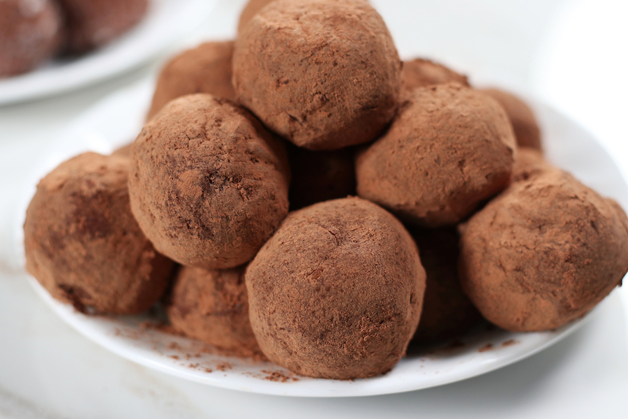 A plate of Old Fashioned Rum Balls served on a plate.