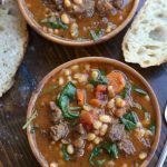 Two wooden bowls of Beef and Bean Stew.