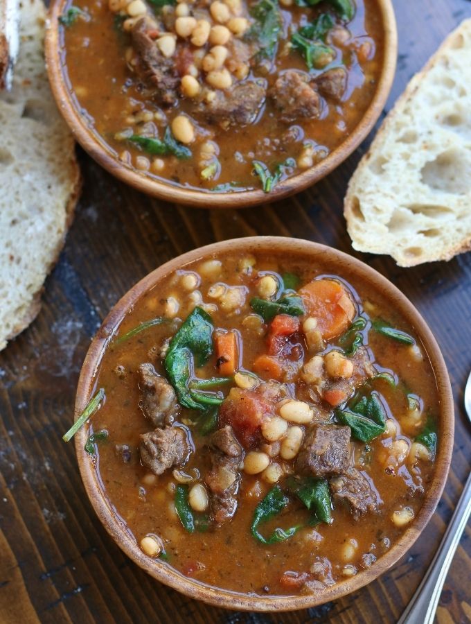 Two wooden bowls of Beef and Bean Stew.
