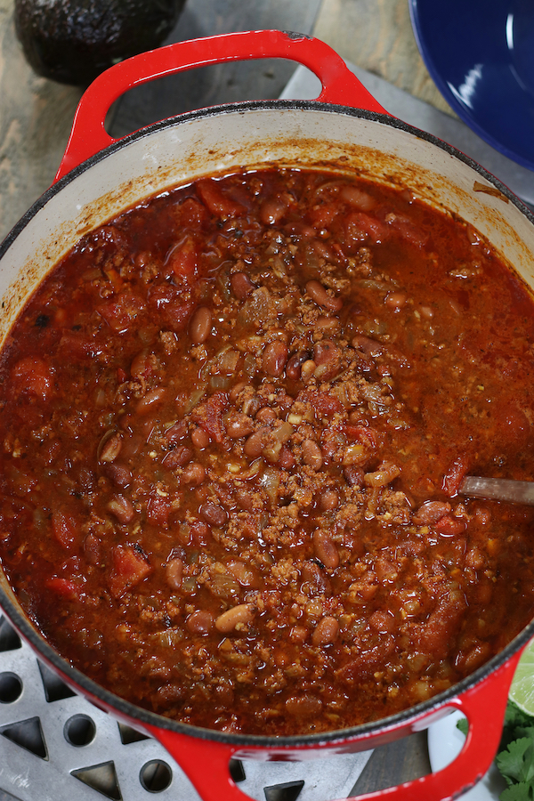 Overhead photo of a red pot of Pinto Bean Soup Recipe.