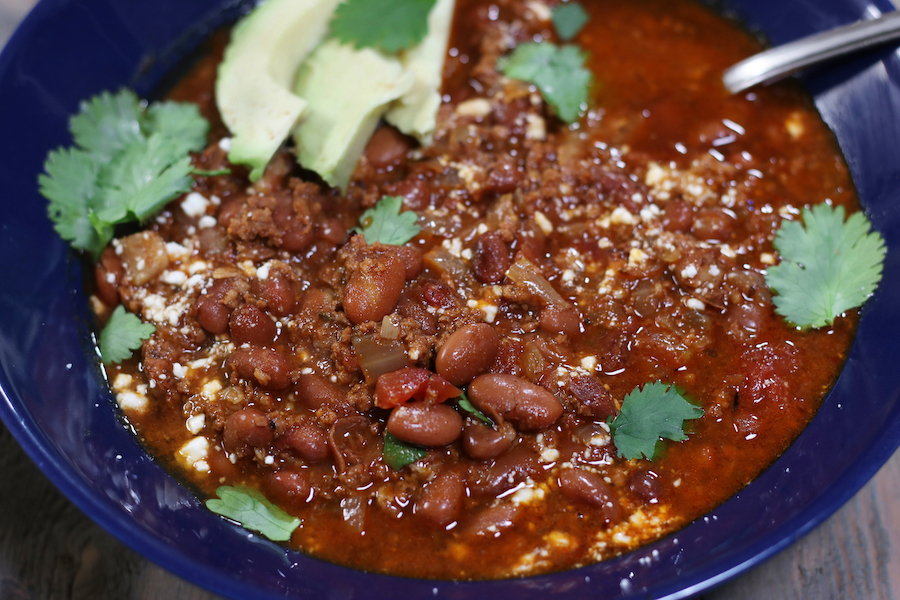 Overhead photo of Pinto Bean Soup in a blue serving bowl.