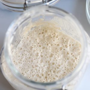 Homemade Sourdough Starter in a glass jar.
