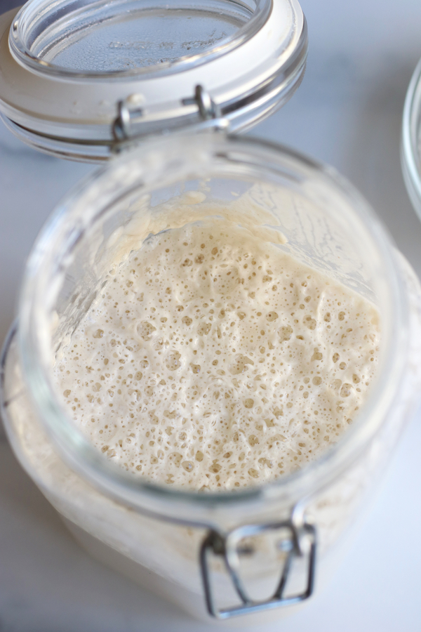 Homemade Sourdough Starter in a glass jar.