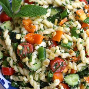 Cold Pasta Salad for summertime in a blue and white bowl.