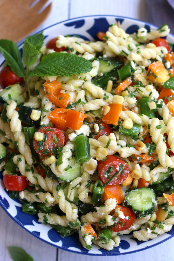 Cold Pasta Salad for summertime in a blue and white bowl.