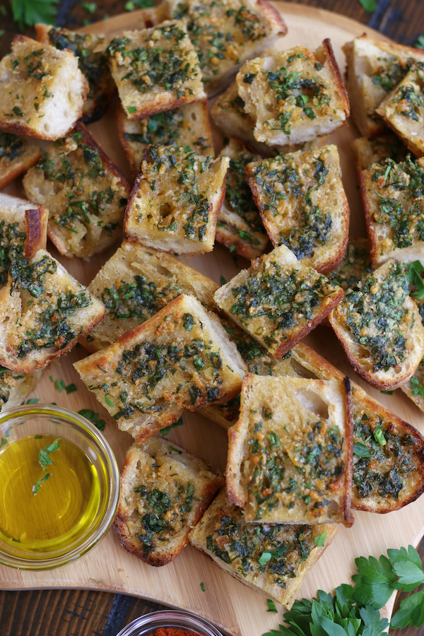 Overhead photo of Homemade Garlic Bread made out of a baguette and cut into slices.