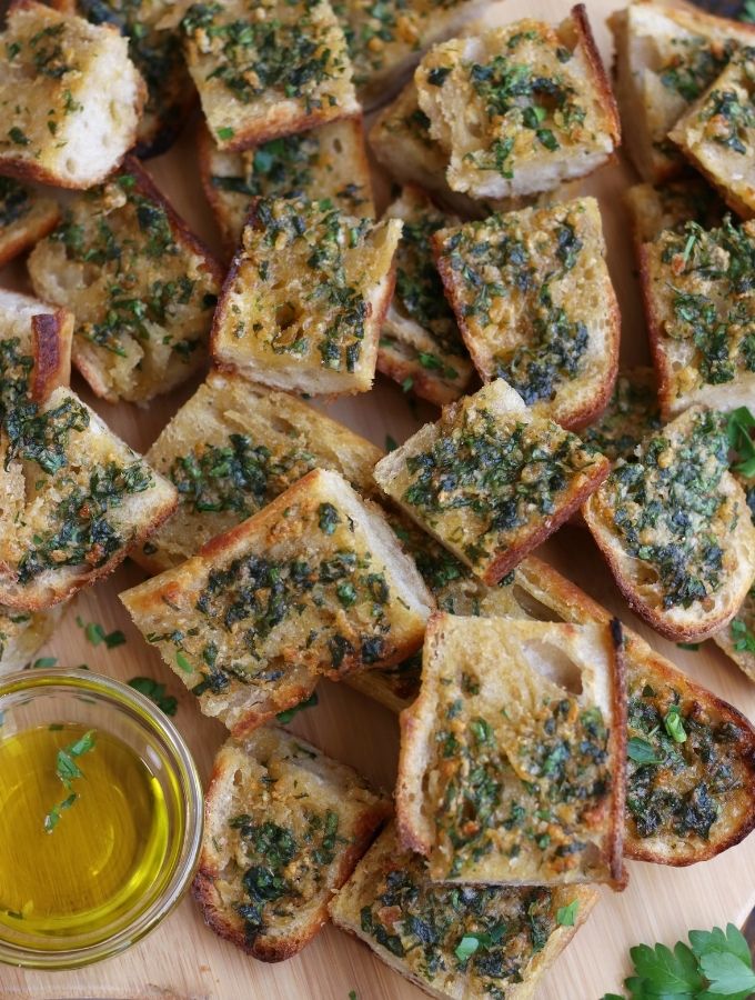 Slices of Sourdough Garlic Bread piled on top of each other.
