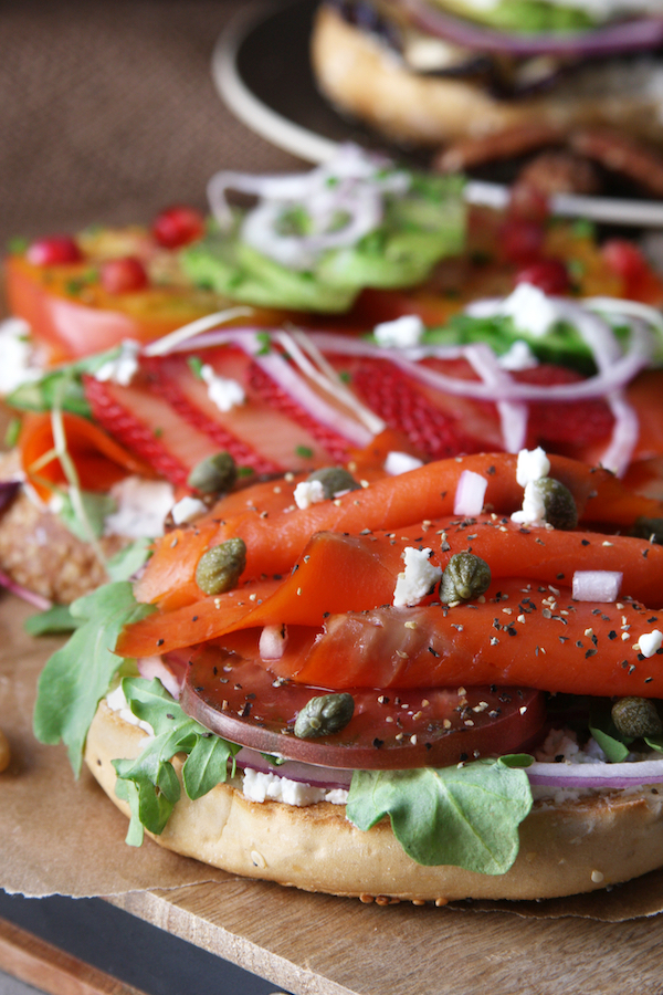 Lox Bagel with heirloom tomato slices, capers and arugula.