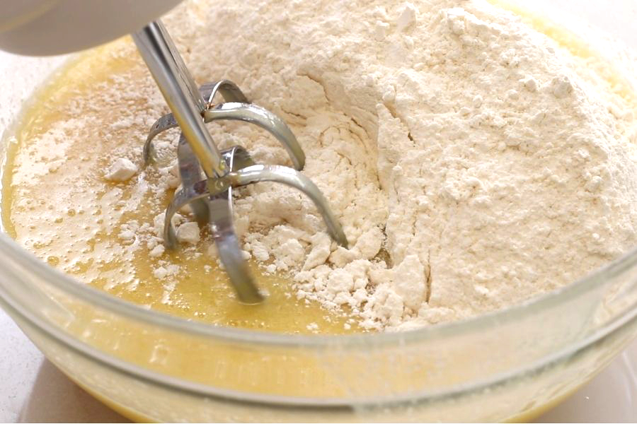 Mixing of the dry ingredients with the wet ingredients for Italian Lemon Pound Cake.