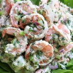 Up close photo of Shrimp Salad on a bed of butter leaf lettuce.