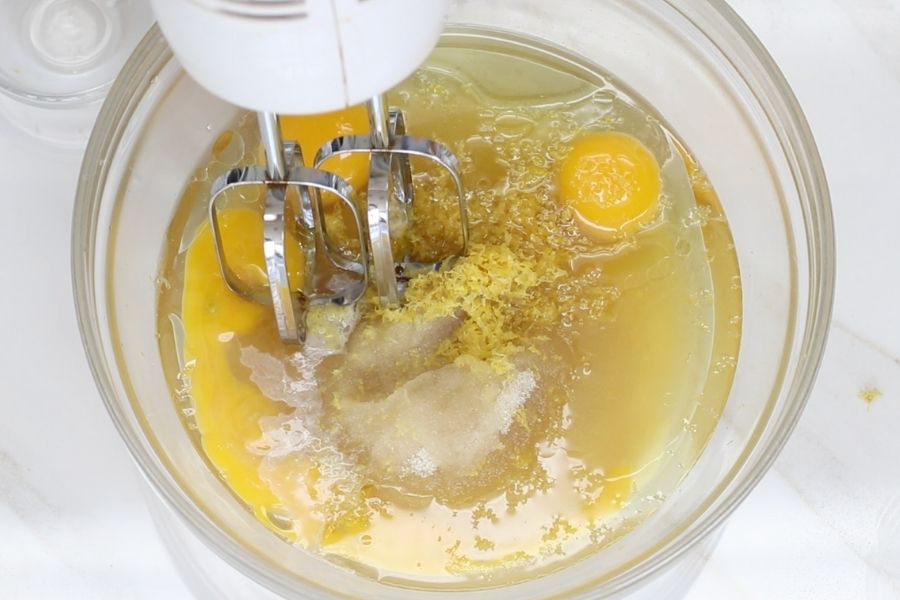 Mixing of the wet ingredients for Lemon Pound Cake.