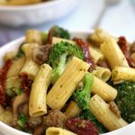 Sausage Pesto Pasta in a white Pasta bowl.