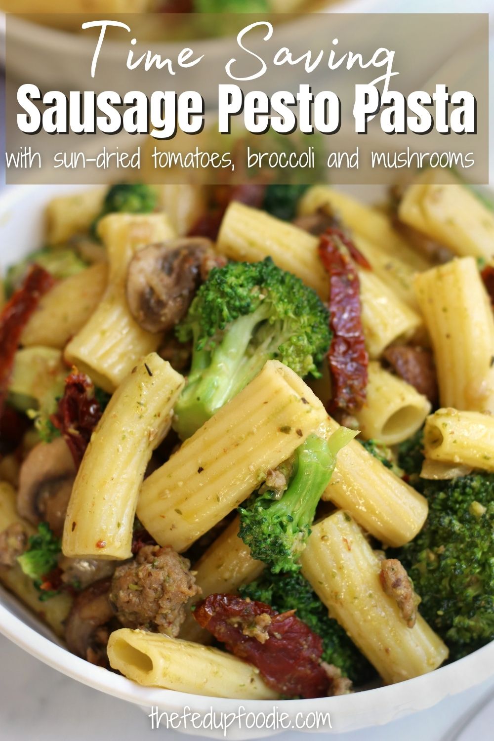 Sausage Pesto Pasta is a dish the whole family will love. Made with pesto, Italian sausage, al dente pasta, broccoli and sun-dried tomatoes. An easy under 30 minute meal perfect for busy weeknights. 
#SausagePasta #SausagePastaRecipes #SausagePestoPasta #BasilPestoPastaRecipes #PestoPasta #PastaAlPesto