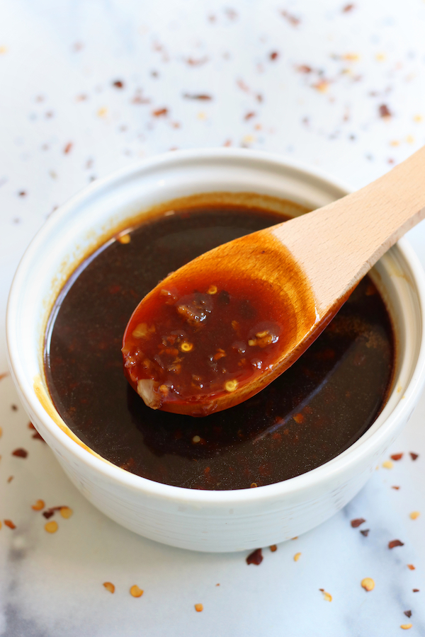 A wooden spoon full of the Best Teriyaki Sauce.