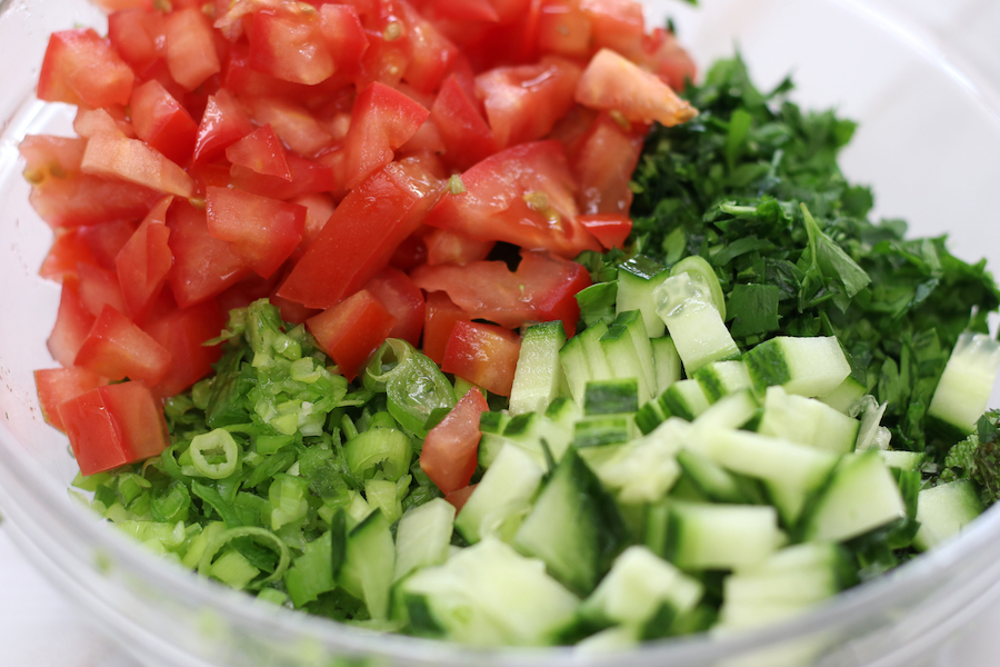 Finely chopped herbs and veggies for Tabouli Salad.